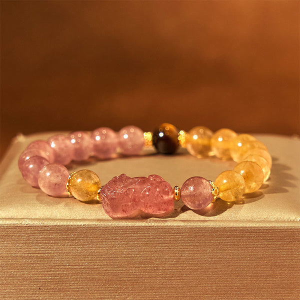 Strawberry Quartz PiXiu Rutilated Quartz Healing Bracelet – pink PiXiu with gold rutile beads on cream fabric, prosperity