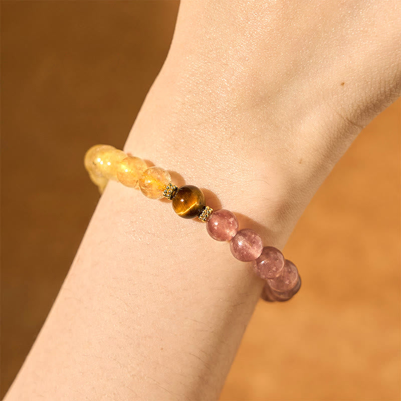 Strawberry Quartz PiXiu Rutilated Quartz Healing Bracelet – wrist view with pink quartz and gold beads on warm skin tone