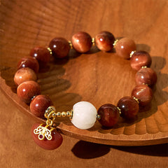 Natural Red Tiger Eye Pumpkin Calm Bracelet – Red tiger eye beads with white accent on carved wooden plate, confidence jewelry