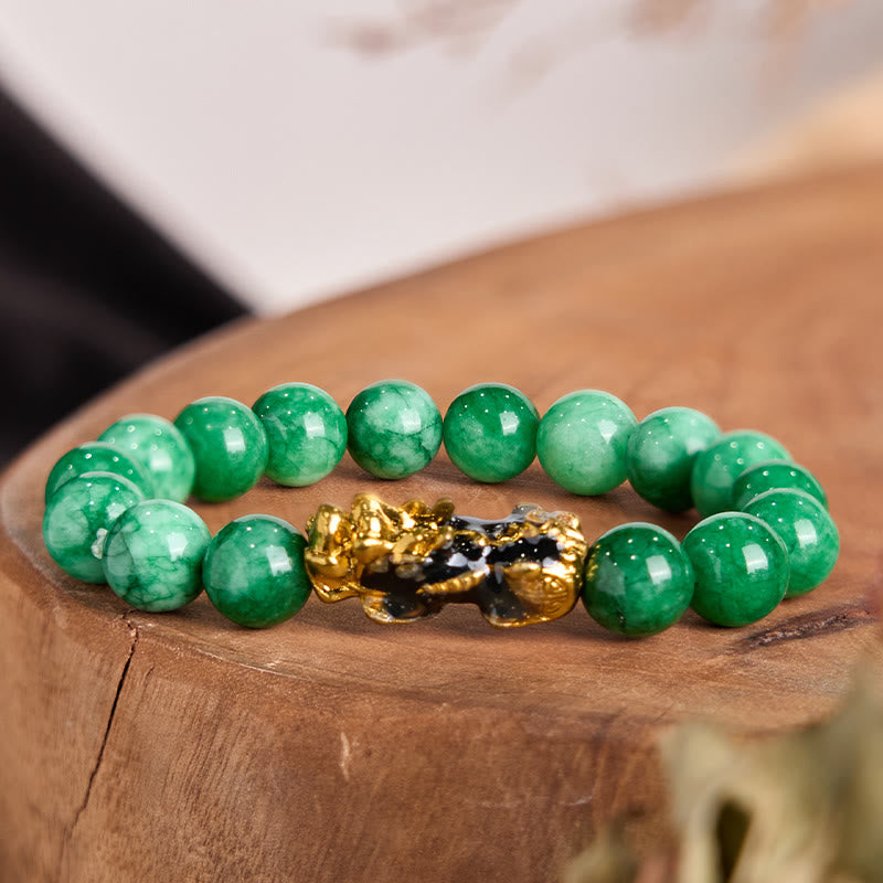 Feng Shui PiXiu Jade Protection Bracelet – Green jade beads with gold black PiXiu charm on wooden stump, success jewelry