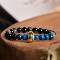 Om Mani Padme Hum Bracelet - Black and blue beaded bracelet with gold charm on wood, mens beaded bracelet