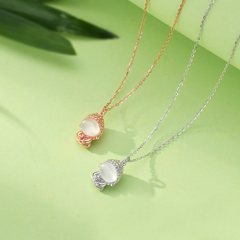 Chalcedony Formless Buddha Necklace – close-up of formless Buddha silhouette in stone