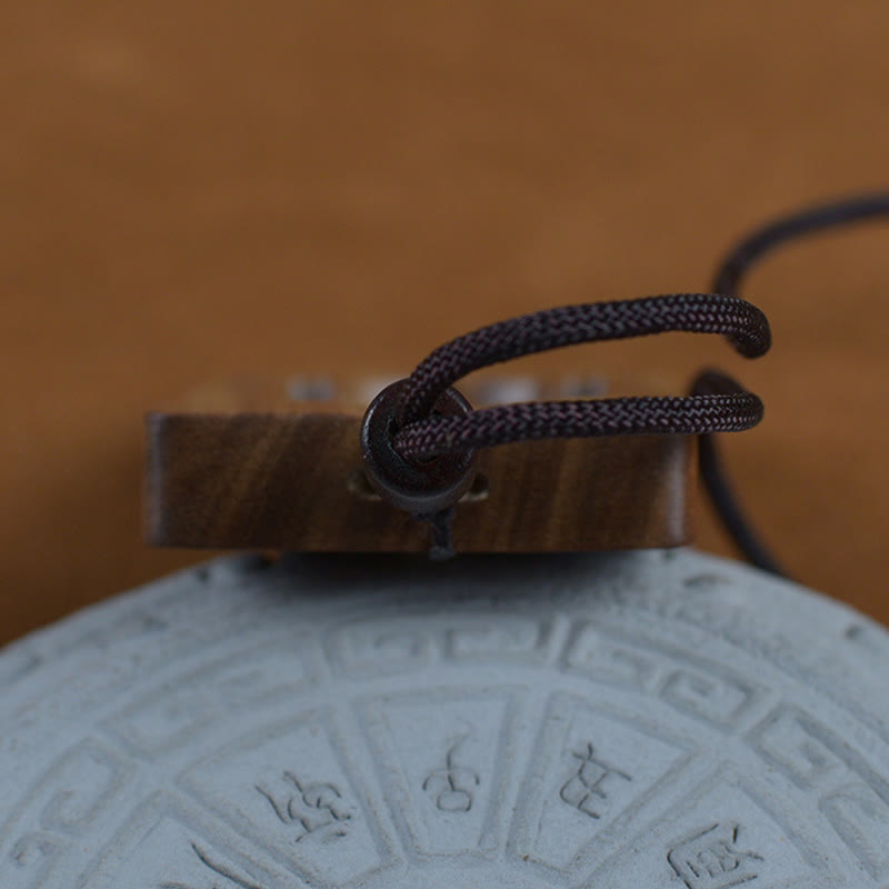 Green Sandalwood Buddha Necklace – three-quarter view showing cord knot and texture