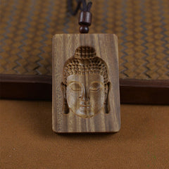 Green Sandalwood Buddha Necklace – Buddha symbol close-up with natural wood grain detail