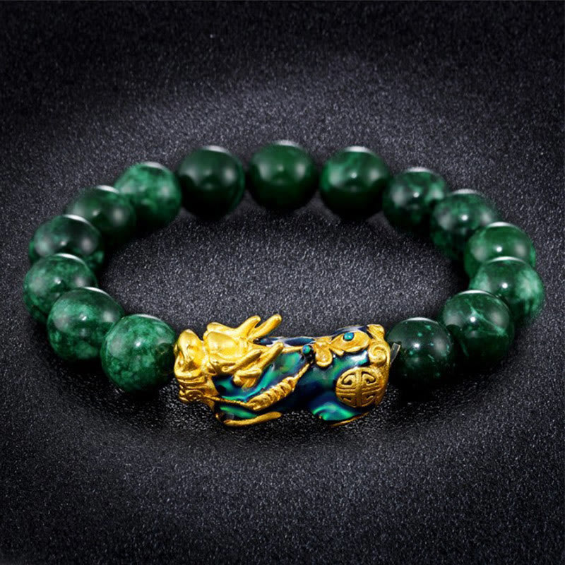 FengShui PiXiu Cyan Jade Bracelet – dark green jade gold PiXiu black textured background luxury