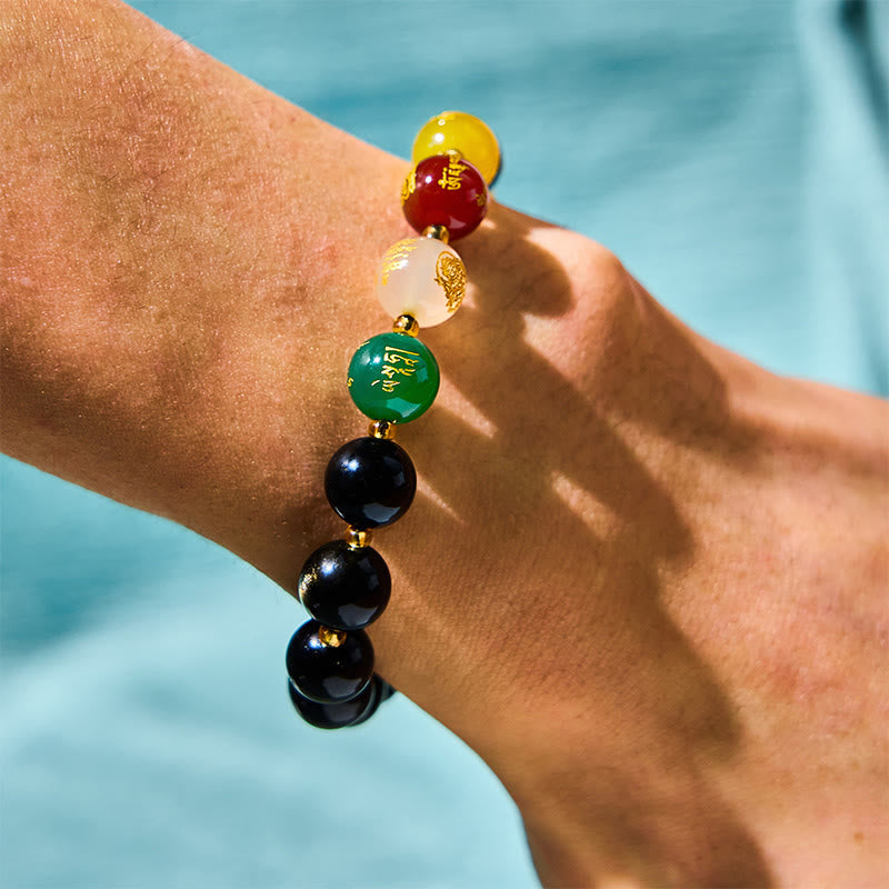 Obsidian PiXiu Five Gods Bracelet – Colorful five directions beads on wrist with green red yellow white, water background