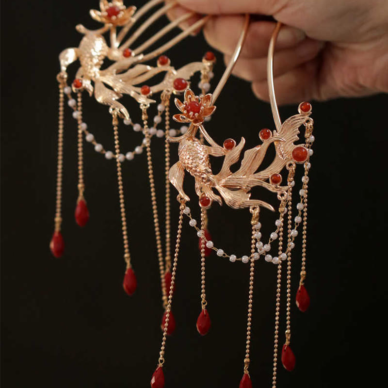 Chinese Koi Fish Hairpin – pair of phoenix hairpins held in hand, red agate pearls, macro, gold tone