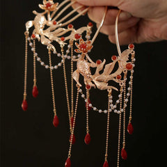 Chinese Koi Fish Hairpin – pair of phoenix hairpins held in hand, red agate pearls, macro, gold tone