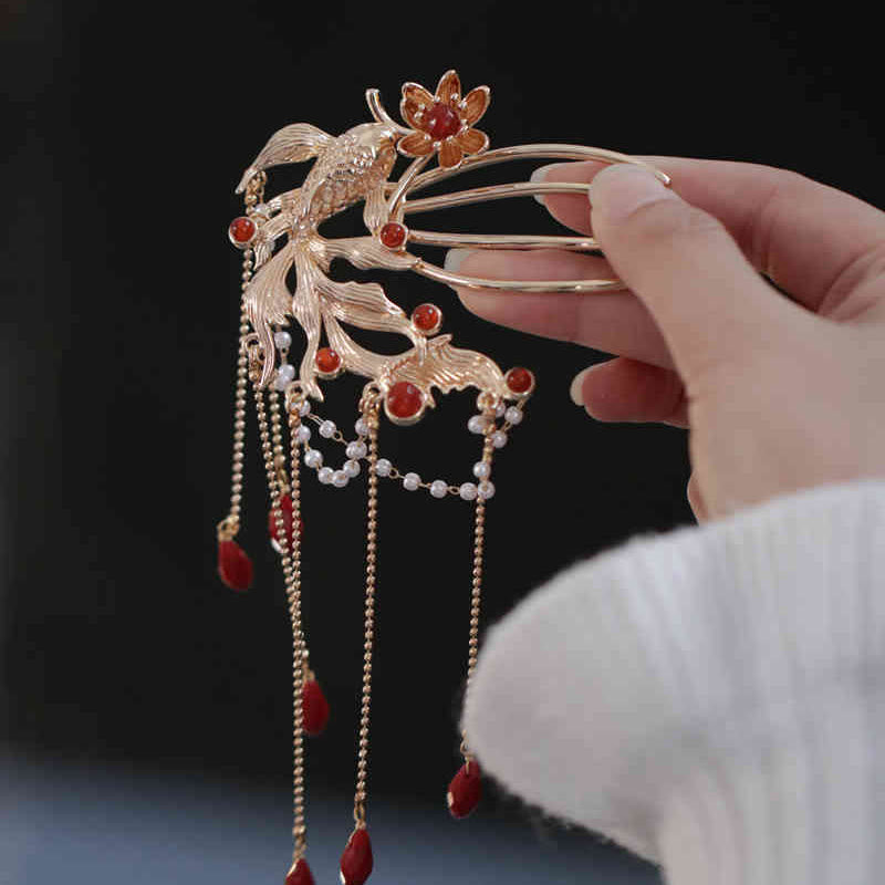 Chinese Koi Fish Hairpin – goldfish hairpin held in hand, triple prong, lotus accent, red drops, detailed