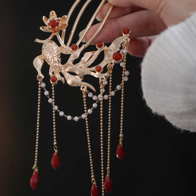 Chinese Koi Fish Hairpin – koi and lotus hairpin held in hand, triple prong, antique gold, red agate tassels
