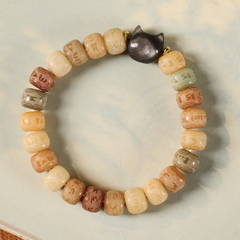 Bodhi Seed Silver Sheen Obsidian Cat Head Wisdom Bracelet – flat lay soft blue backdrop, wisdom jewelry