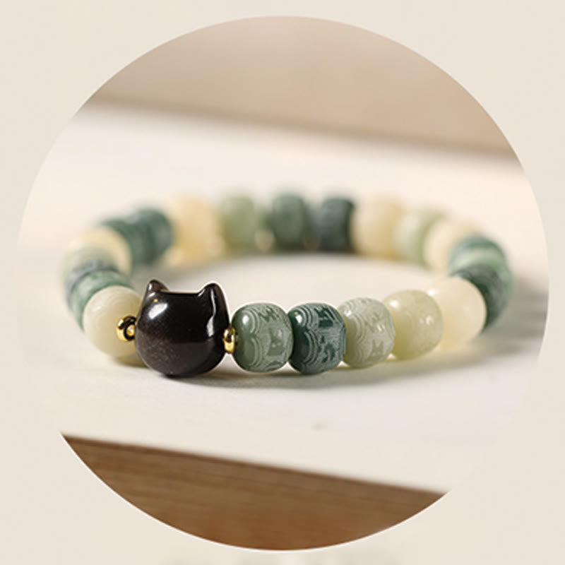 Bodhi Seed Silver Sheen Obsidian Cat Head Wisdom Bracelet – green variant soft focus close-up, gentle wisdom
