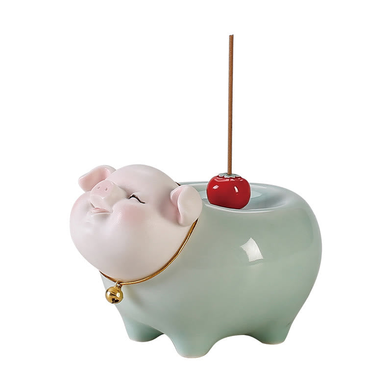 Ceramic Little Pig Incense Burner – White background, pink head, gold collar, red cherry holder