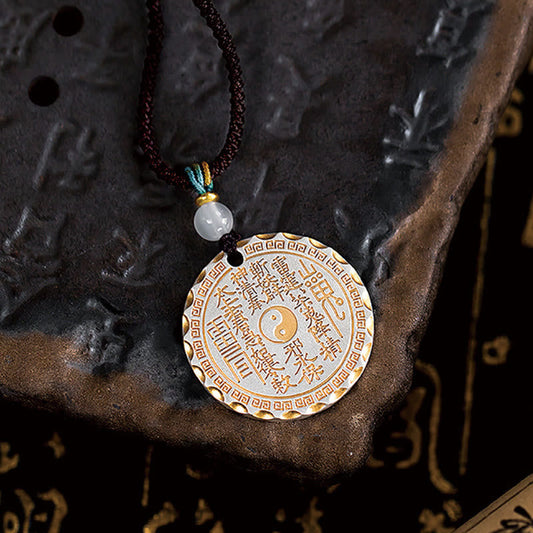 Mountain Ghosts Spend Money Yin Yang Bagua De - Silver amulet with gold Taoist inscriptions on carved stone, yin-yang talisma