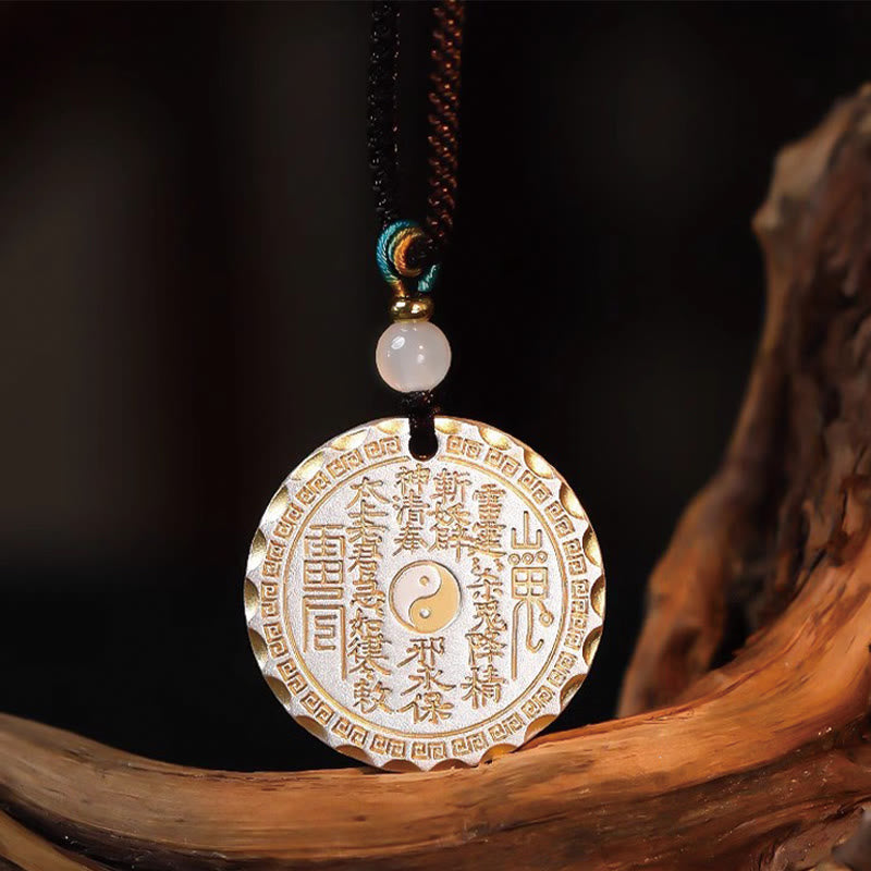 Mountain Ghosts Spend Money Yin Yang Bagua De - Gold-tone protective amulet on driftwood, black bg, Taoist pendant necklace