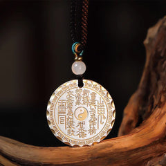 Mountain Ghosts Spend Money Yin Yang Bagua De - Gold-tone protective amulet on driftwood, black bg, Taoist pendant necklace