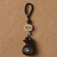 Sandalwood Om Mani Padme Hum Key Chain – dark wood pendant with braided cord, calm grounding
