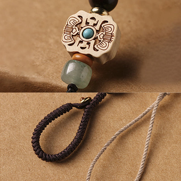 Sandalwood Om Mani Padme Hum Key Chain – carved bead and cord detail, artisan craftsmanship