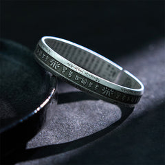 Lotus Cuff Bracelet – Antiqued silver band with Tibetan script borders and sacred mantra center, spiritual jewelry