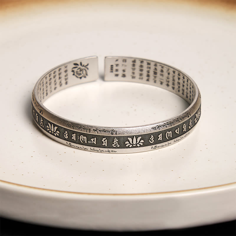 Silver Lotus Mantra Cuff – Clean view of Tibetan Om Mani Padme Hum engraving with lotus and stippled texture