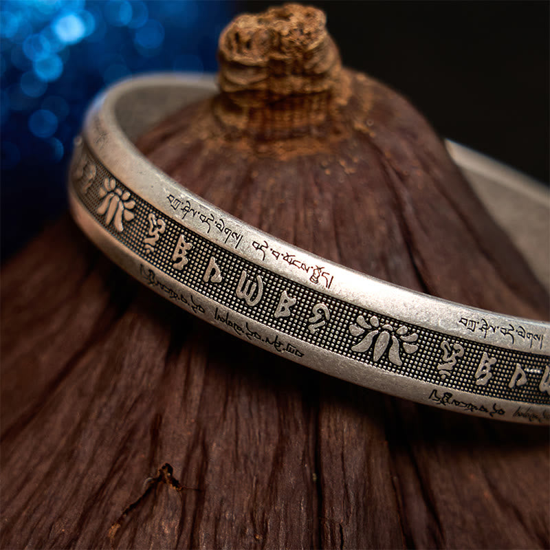 Om Mani Padme Hum Silver Cuff – Artisan carved bracelet with Tibetan Buddhist script on oxidized silver finish
