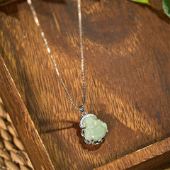 Hetian Jade Laughing Buddha Necklace – close-up of laughing Buddha joyful face carving