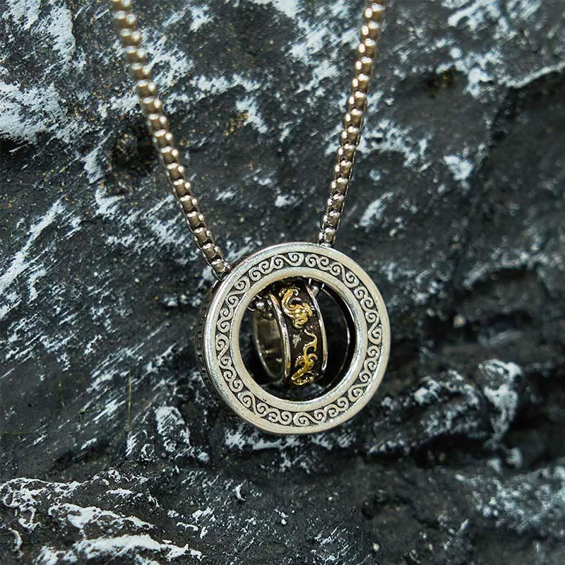 Double Ring PiXiu Necklace – Close-up of silver peace buckle pendant with detailed golden PiXiu on chain