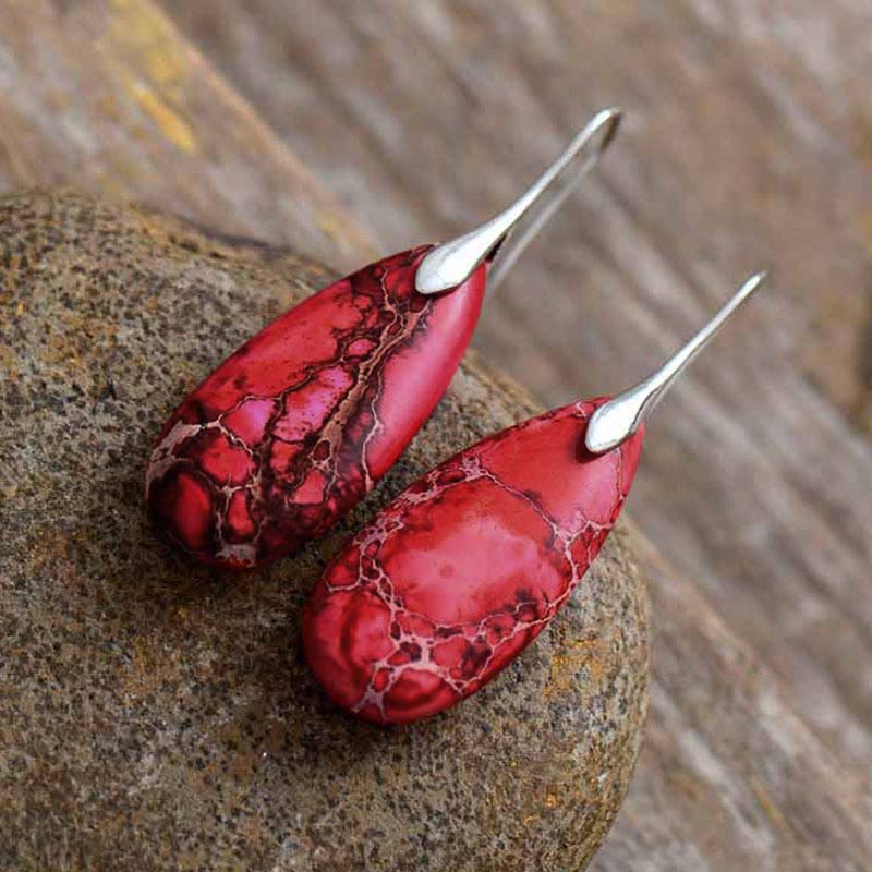 Emperor Stone Healing Crystal Earrings – Deep rose red teardrop earrings with black web matrix patterns and silver bezel setting on natural stone