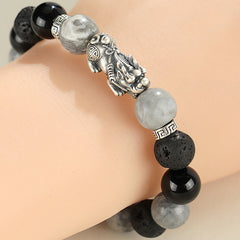 999 Silver PiXiu Bracelet – Bracelet worn on wrist showing silver PiXiu with black onyx and grey jasper beads