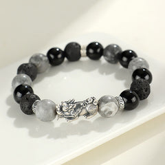 999 Silver PiXiu Bracelet – Silver PiXiu with black onyx, grey jasper and lava rock beads on white surface, protection jewelry