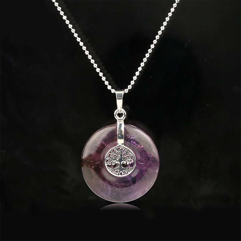 Tree of Life Crystal Necklace – amethyst purple donut pendant on black, frontal silver chain view