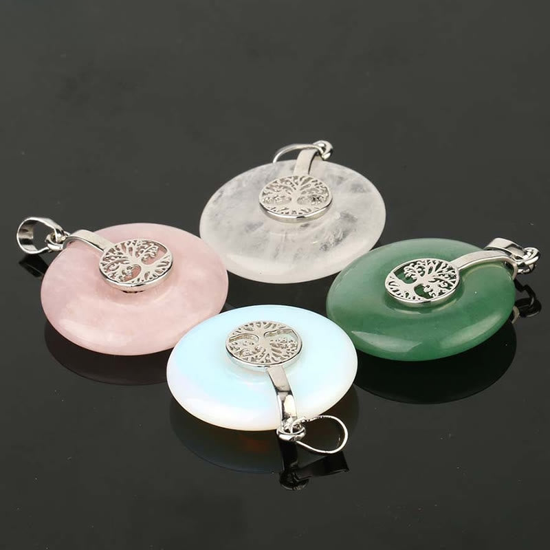 Tree of Life Crystal Necklace – four crystal pendants on reflective black, quartz rose quartz aventurine