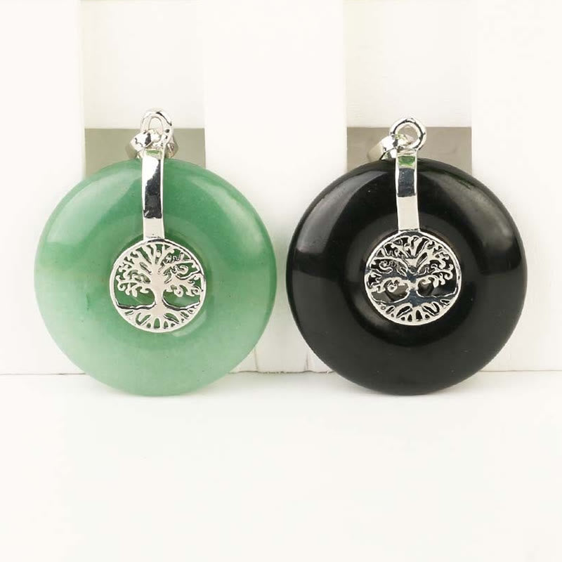 Tree of Life Crystal Necklace – aventurine and black onyx pendants on white with stands, frontal view