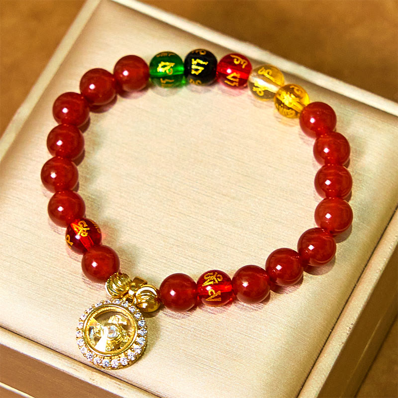 Red Agate Wealth Gods Bracelet – flat lay in satin jewelry box with crystal halo deity pendant, gift ready