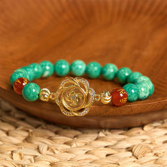 Natural Jade Om Mani Padme Hum Bracelet – Resting on wooden bowl with woven mat, jade bead jewelry