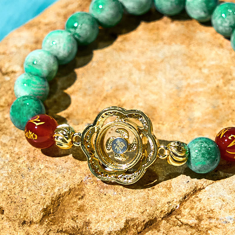 Natural Jade Om Mani Padme Hum Bracelet – Macro of gold filigree charm with blue stone center, jade bracelet
