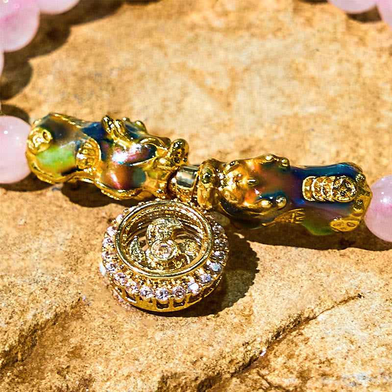 Close-up of two enamel PiXiu charms with crystal spinner pendant