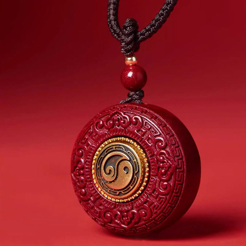 Rotatable Yin Yang Pendant - Close-up taijitu on carved red cinnabar, harmonious