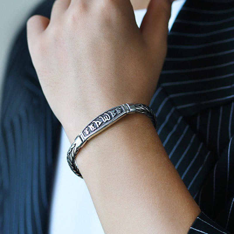 Vajra Om Mani Padme Hum Bracelet – Close-up on wrist showing oxidized silver finish and engraved Tibetan script