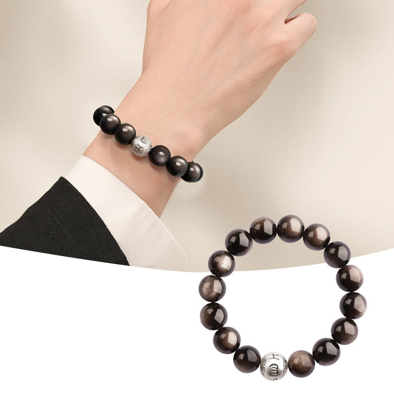 Silver Sheen Obsidian Bracelet – worn with formal suit jacket beside white product shot, elegant protection grounding
