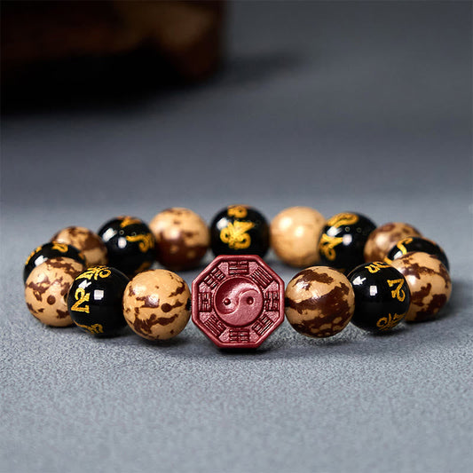 Bodhi Seed Bagua Yin Yang Bracelet – Octagonal red yin-yang medallion with black mantra beads, feng shui
