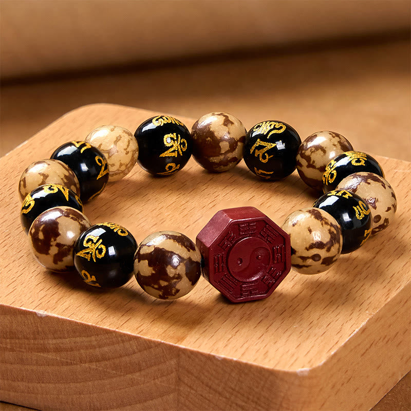 Bodhi Seed Bagua Yin Yang Bracelet – On light wood surface showing alternating bead pattern, Zen bracelet