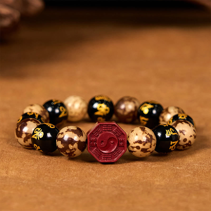 Bodhi Seed Bagua Yin Yang Bracelet – Front view on warm brown surface, octagonal bagua centerpiece