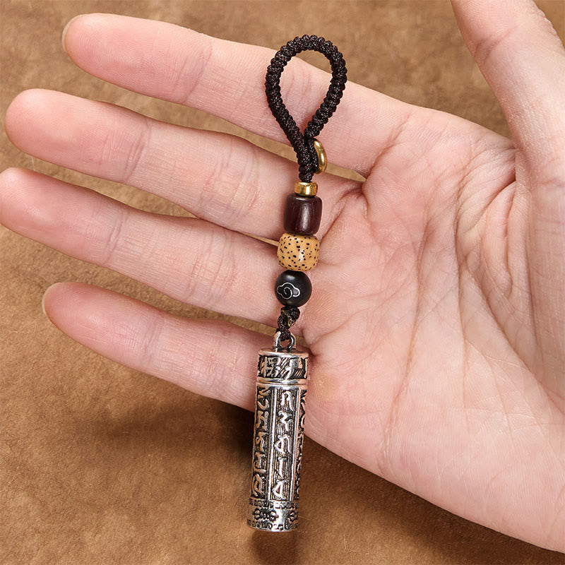 Tibetan Copper Vajra Key Chain – held in palm showing compact size and engraved details, everyday carry