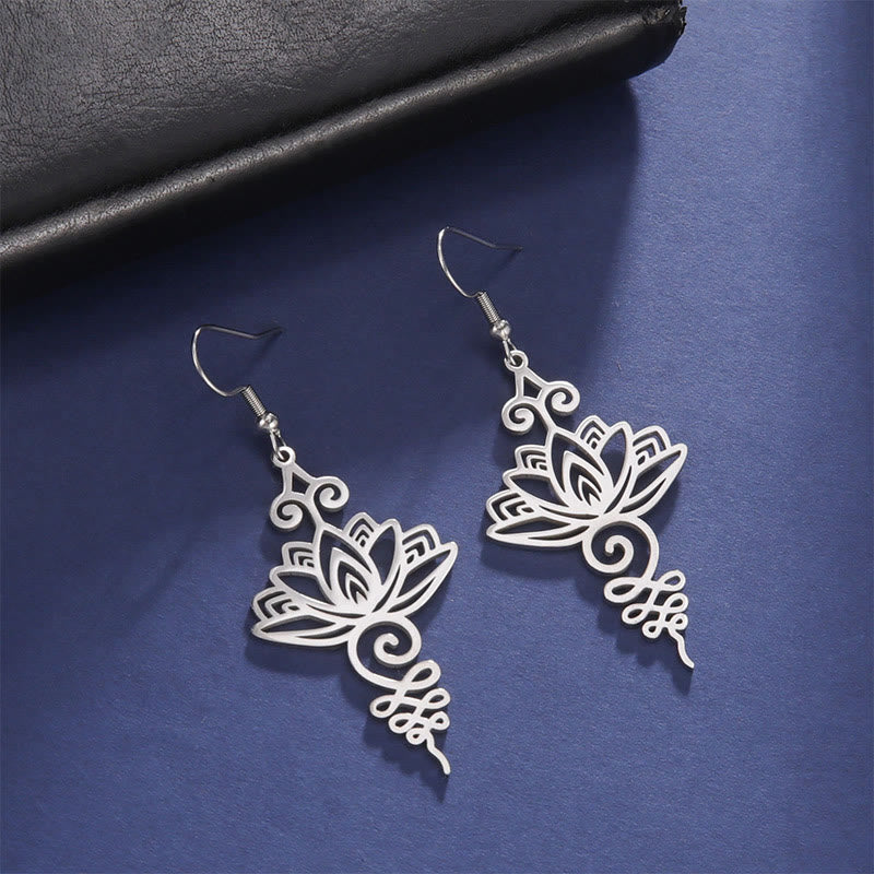 Hollow Lotus Stainless Steel Enlightenment Drop Earrings - silver filigree lotus on navy fabric, boho spiritual style
