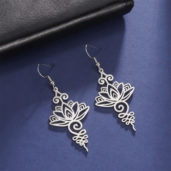 Hollow Lotus Stainless Steel Enlightenment Drop Earrings - silver filigree lotus on navy fabric, boho spiritual style