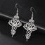 Hollow Lotus Stainless Steel Enlightenment Drop Earrings - silver lotus filigree pair on black leather, spiritual dangle