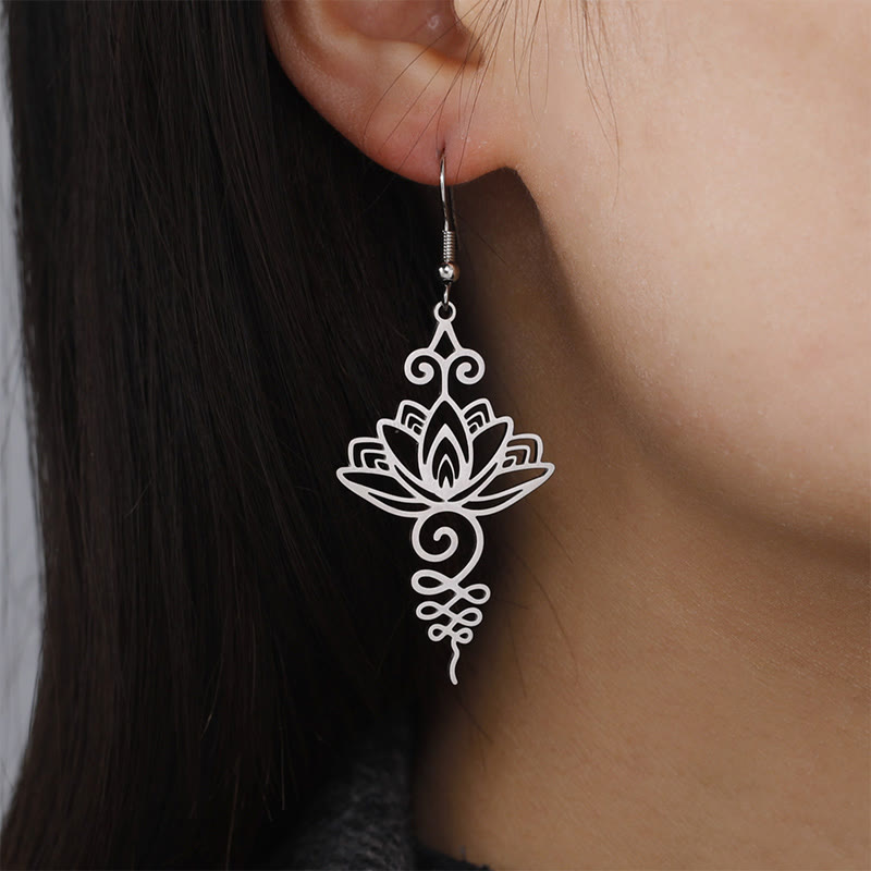 Hollow Lotus Stainless Steel Enlightenment Drop Earrings - worn on ear, side profile showing lotus dangle length, elegant