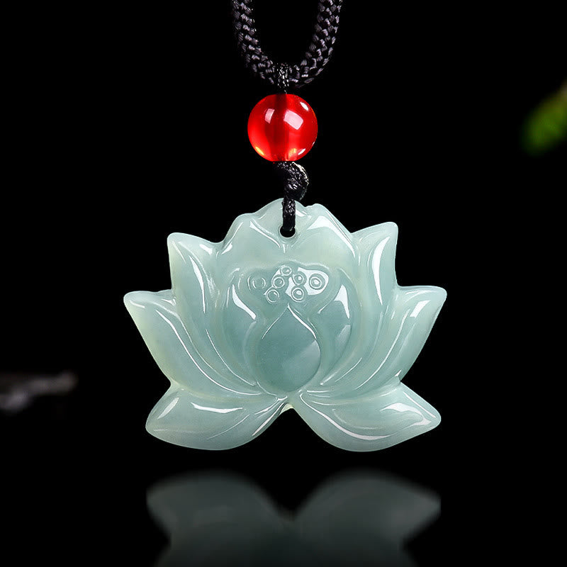 Lotus Flower Carved Jade Prosperity Necklace Pendant - carved lotus on black cord, front view on glossy dark surface, luck