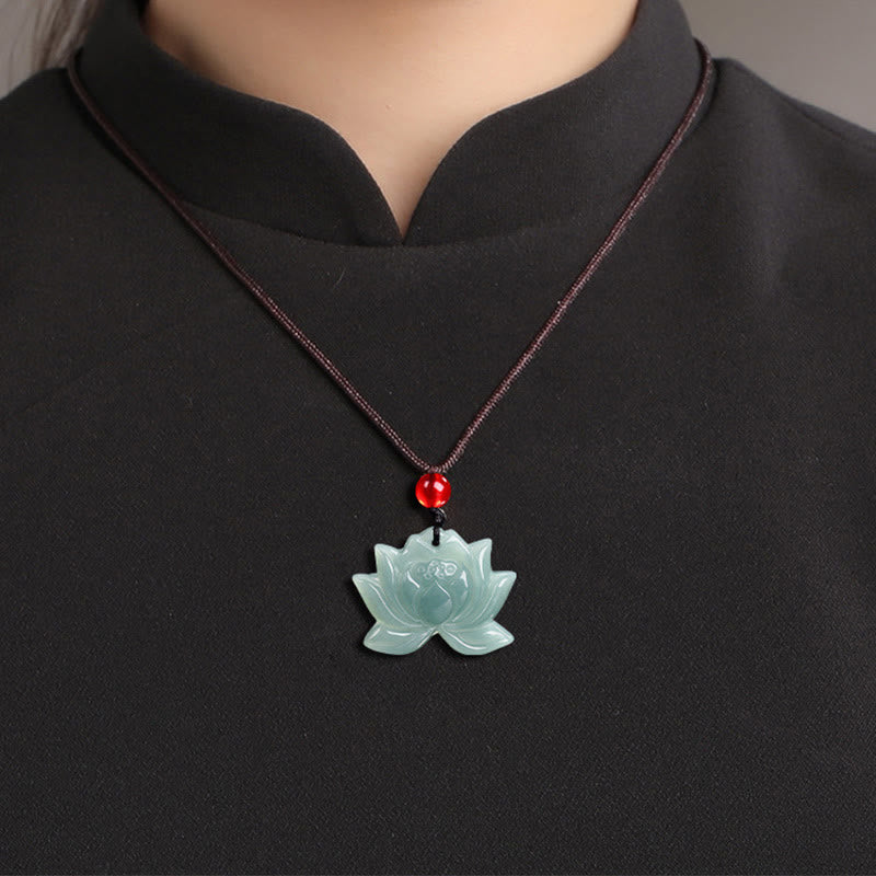 Lotus Flower Carved Jade Prosperity Necklace Pendant - worn on chest with black collar, lifestyle shot, zen necklace